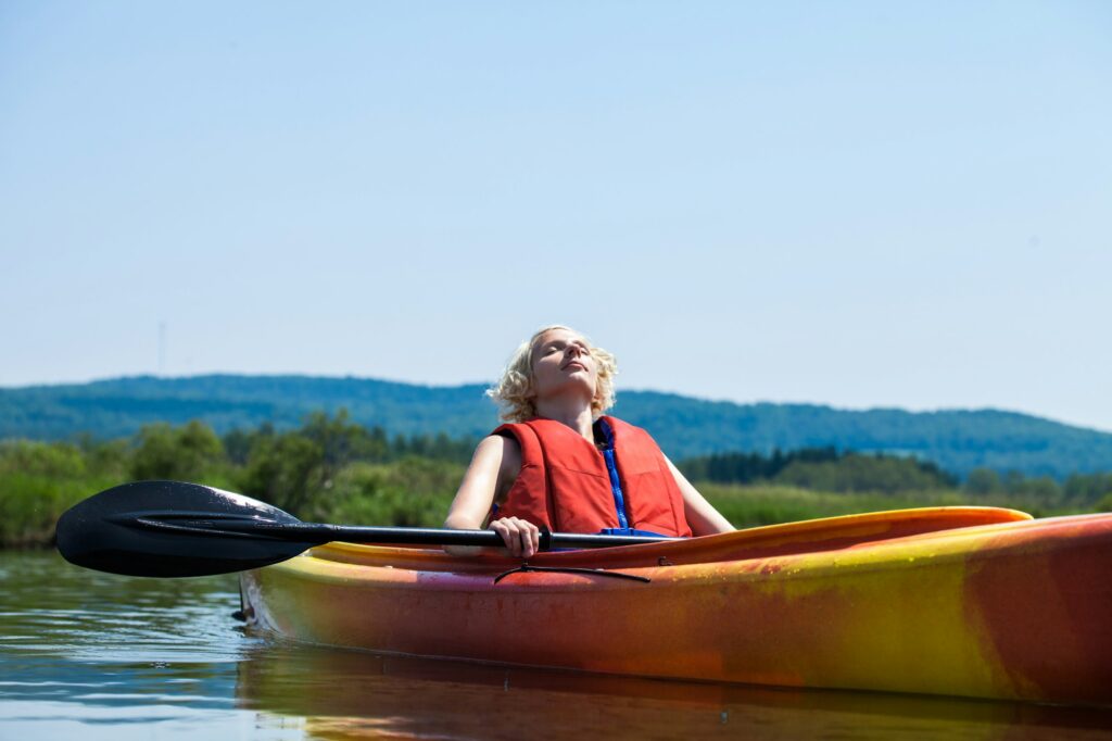 Woman Relaxing on a Kayak and Enjoying her Life